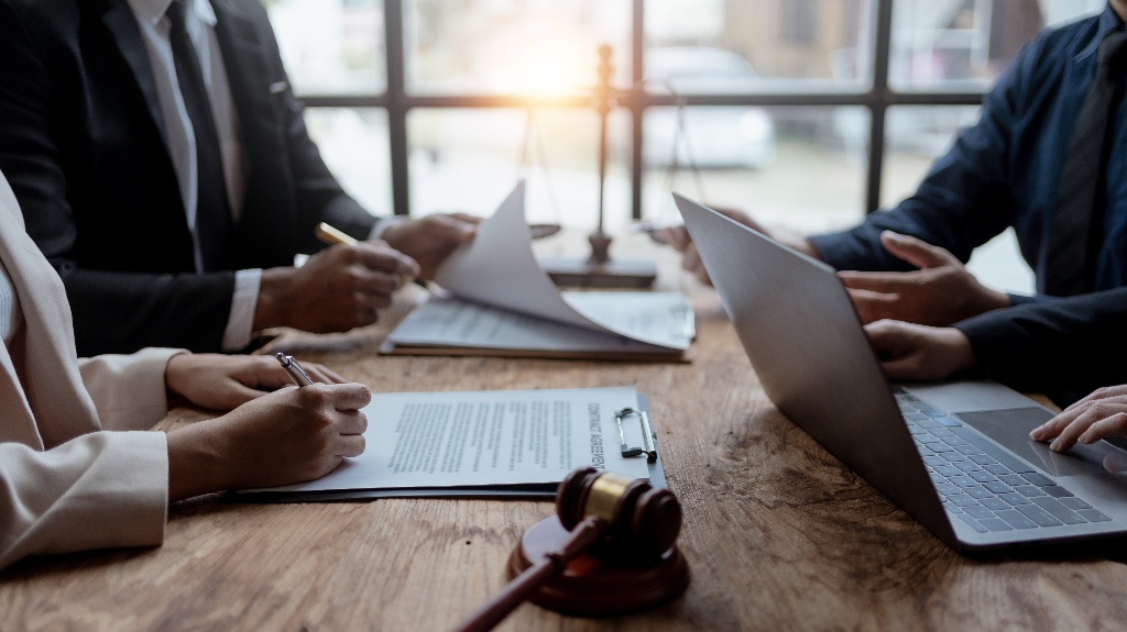 Lawyer is reviewing documents with clients