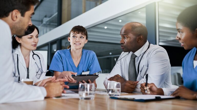 doctors discussing paperwork