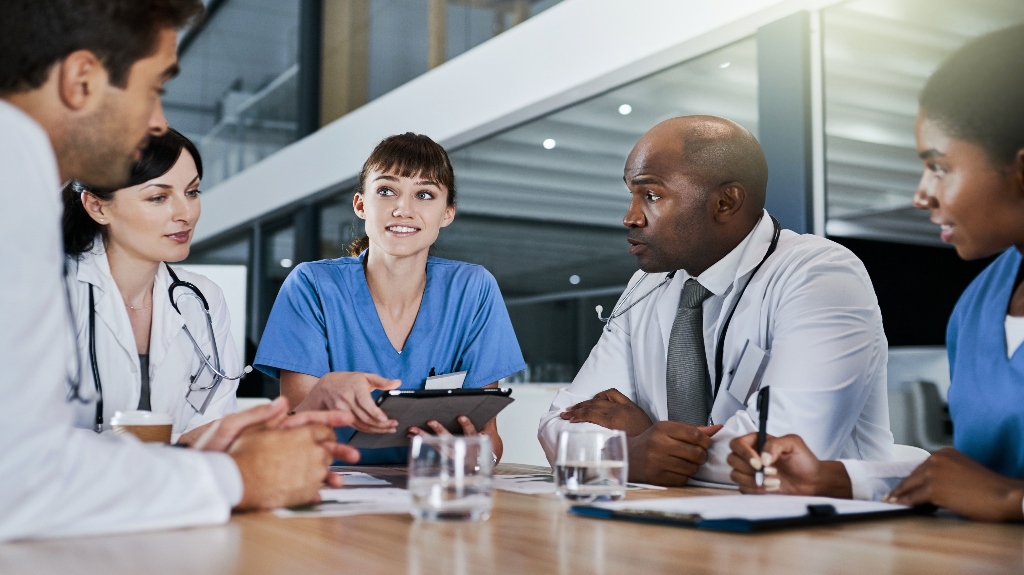 doctors discussing paperwork