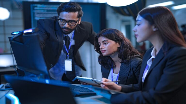 private equity team reviewing computer