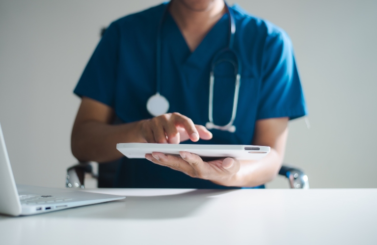Professional healthcare worker calculating finance and budget data